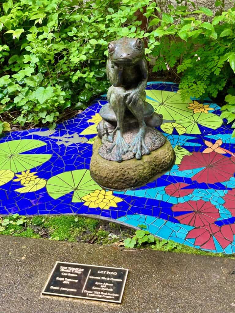 The Thinker Frog stature on the Lilly Pond mosaic outside the McMinnville Public Library. kid-friendly things to do in mcminnville oregon