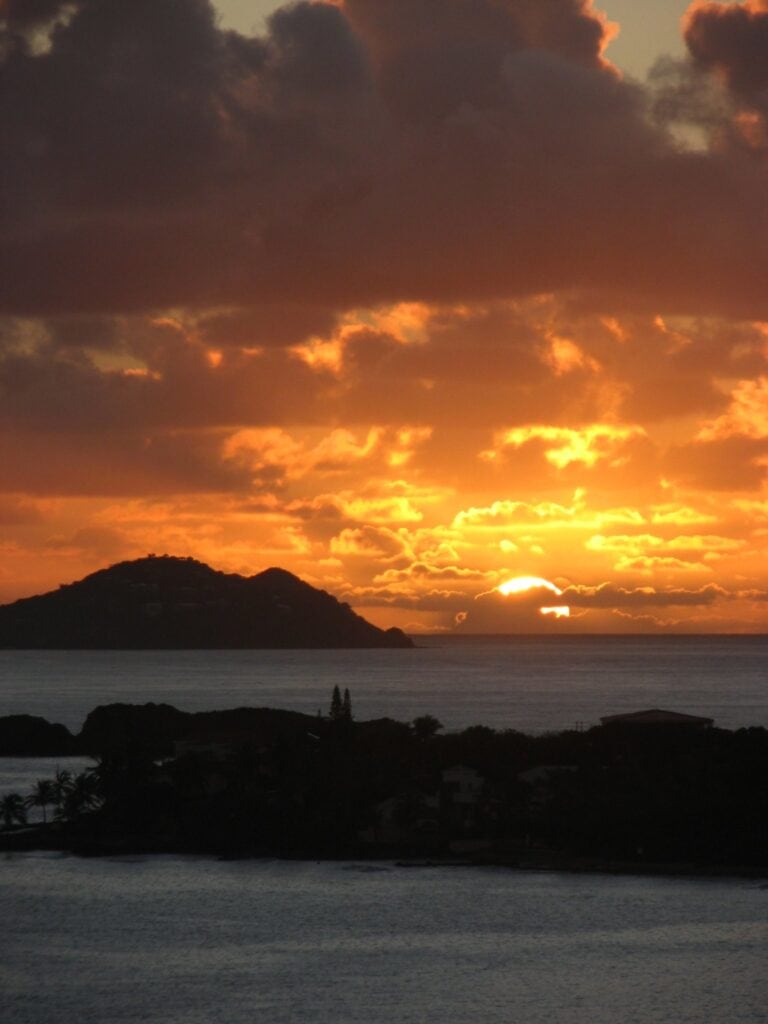 A tropical sunset closes the day at Virgin Islands National Park. Virgin Islands National Park is one of the best national parks to visit in November and December.