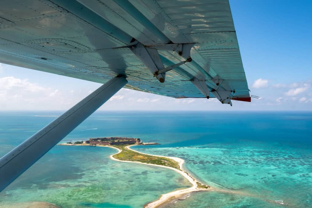 An aerial shot shows one of the islands that make up Dry Tortugas National Park. Dry Tortugas National Park is one of the best national parks to visit in November and December.