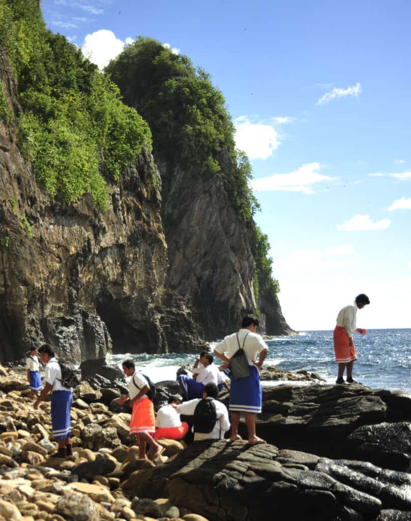 Children explore at a beach at the National Park of American Samoa. 