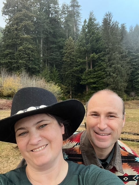 My wife and I smile at Elk Prairie in Redwood National Park. 