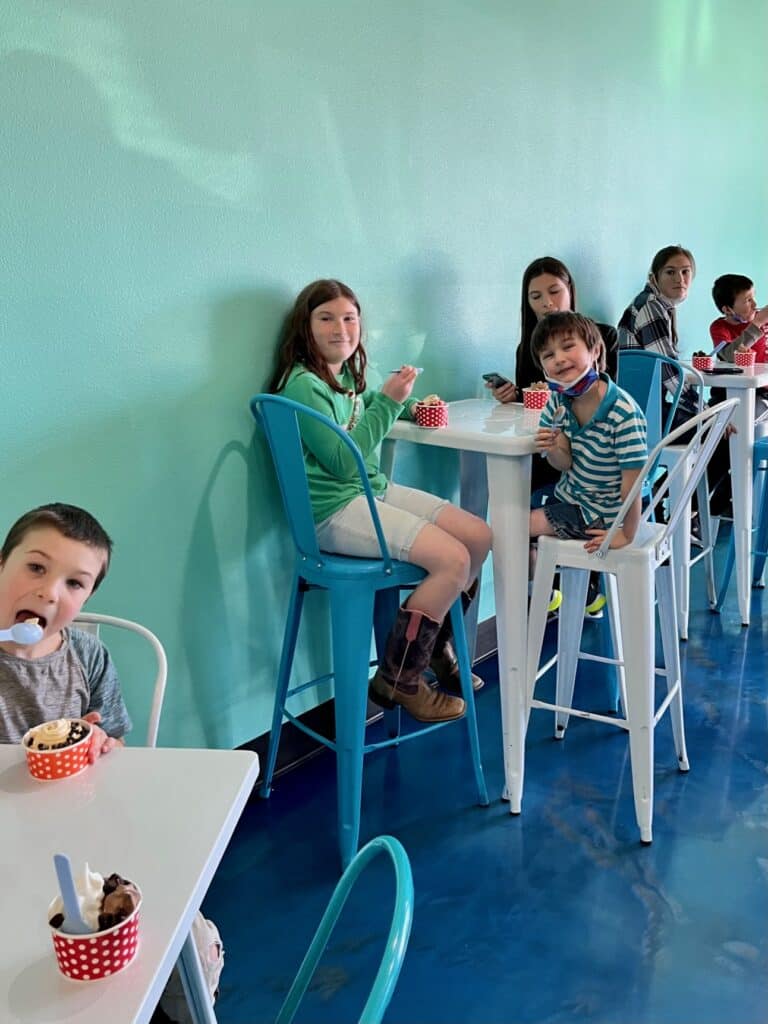 Our kids enjoying frozen yogurt inside Heavenly Yogurt.