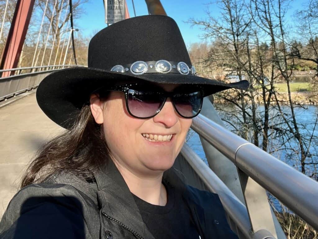 Jenn in cowgirl hat and sunglasses.