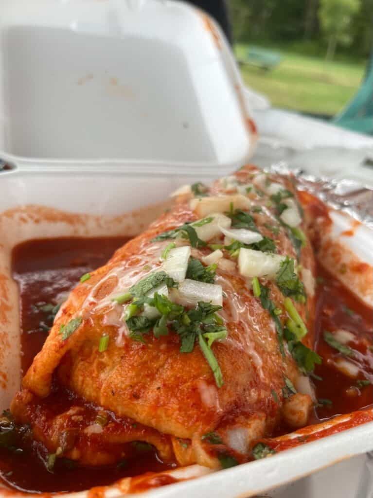 Burrito topped with enchilada sauce from El Caporal Taqueria food truck in Silverton Oregon.