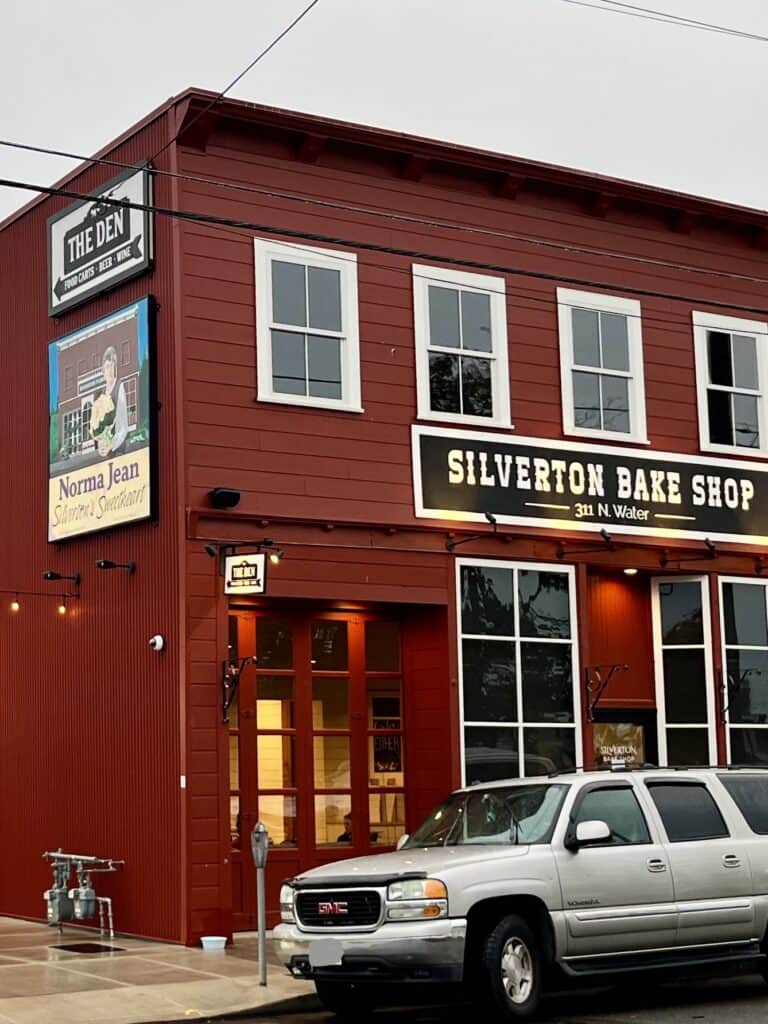 Facade of the Silverton Bake Shop, showing the sign for The Den in back.