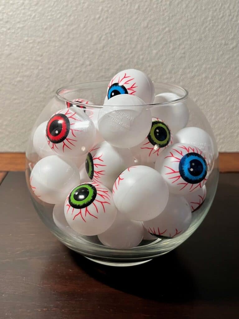 Easy party decor: these eyeball ping pong balls from the local dollar store in a glass dish.