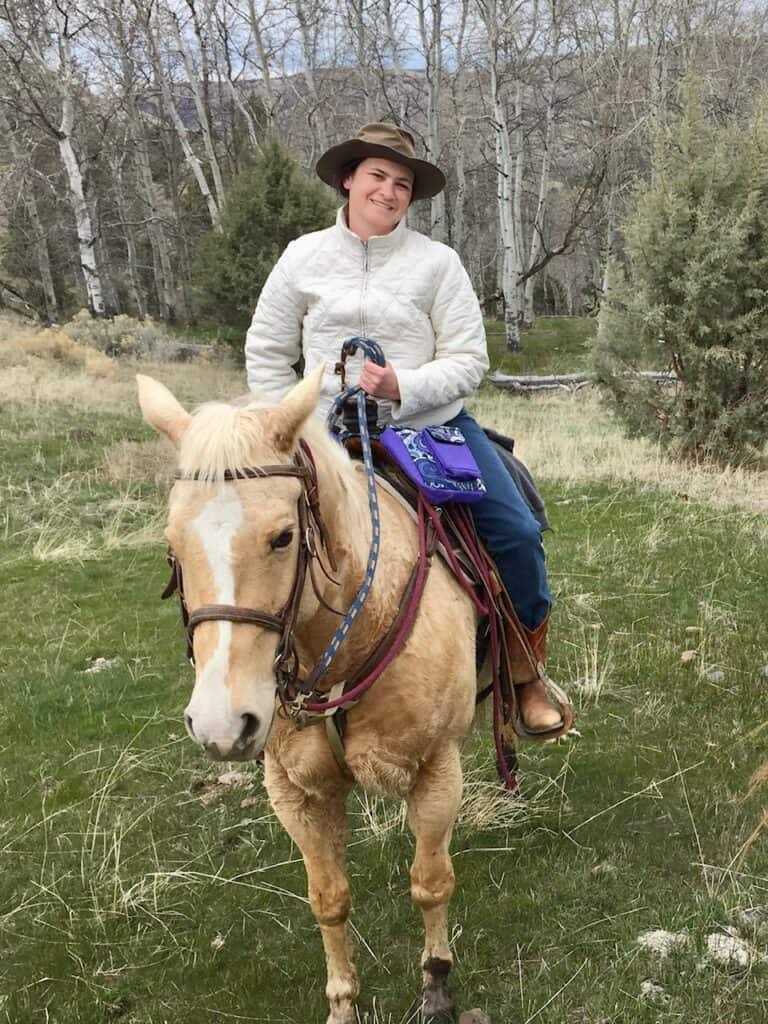 Jenn on horseback in Eastern Oregon. Gifts for cowgirls.