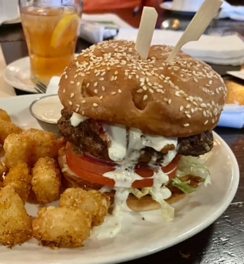 The tall, delicious Captain Neon Burger at McMenamins Pub. McMenamins is one of the best breweries in McMinnville and Carlton.