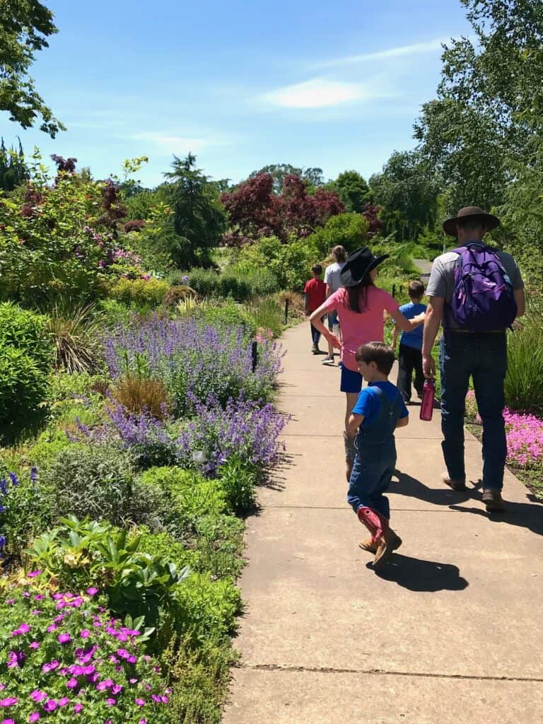 Our family walks past the flowers on a sunny spring day at the Oregon Garden. 