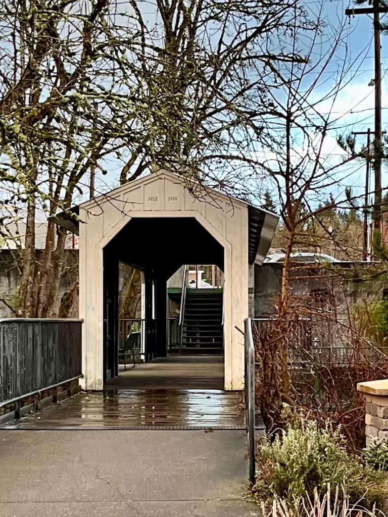 Pedestrian covered footbridge over Silver Creek in Silverton Oregon.