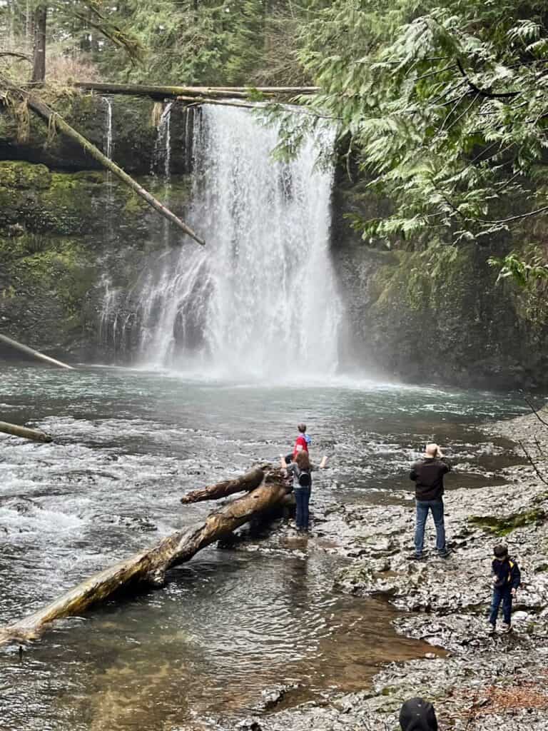 Photo of Brian and some of our kids in front of Upper North Falls.