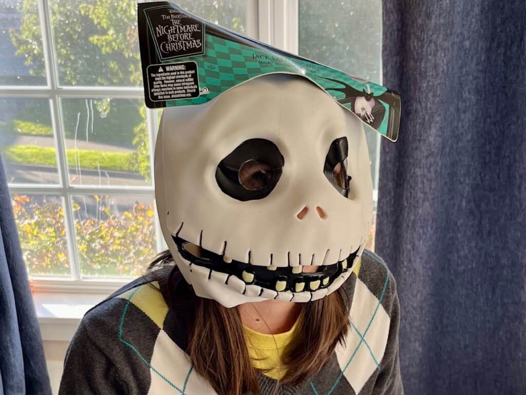 Our teen daughter in a Jack Skellington mask.