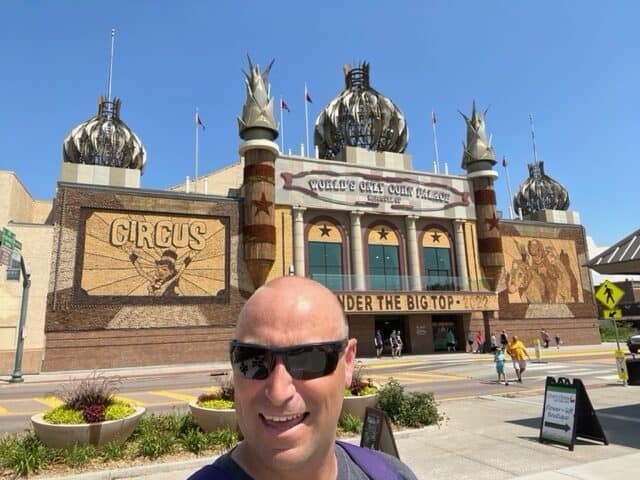 I smile in a selfie in front of the World's Only Corn Palace. The Corn Palace is one of the best things to do in Mitchell SD.