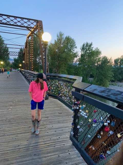 Our daughter admires the locks along the Van Buren street footbridge in Missoula. Zoo Town boasts a number of the best restaurants in Montana.