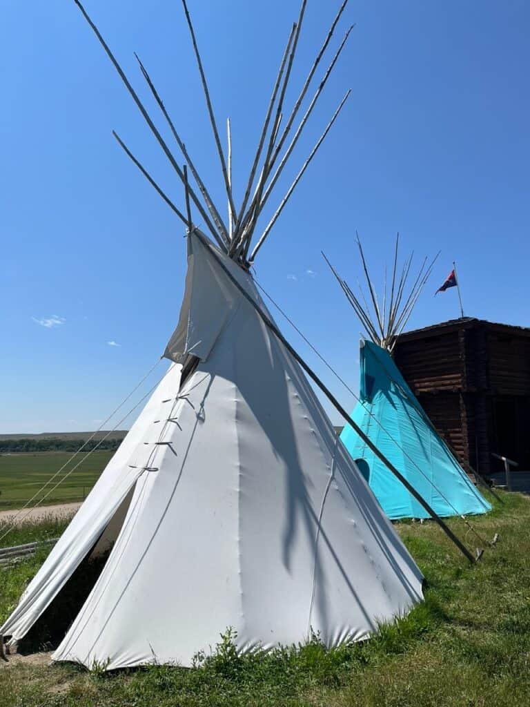 Tipis stand at Custer Battlefield Trading Post. Custer Battlefield Trading Post is a neat place to visit if you're planning to drive to restaurants in Badlands National Park.
