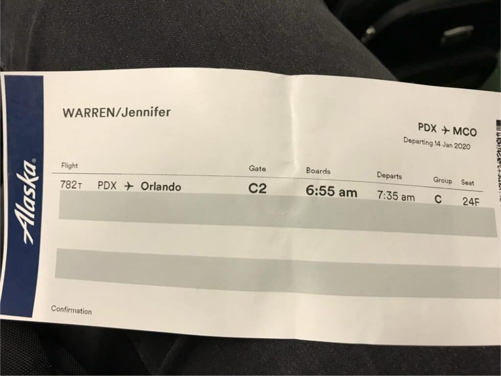 Paper boarding pass from Alaska Airline.