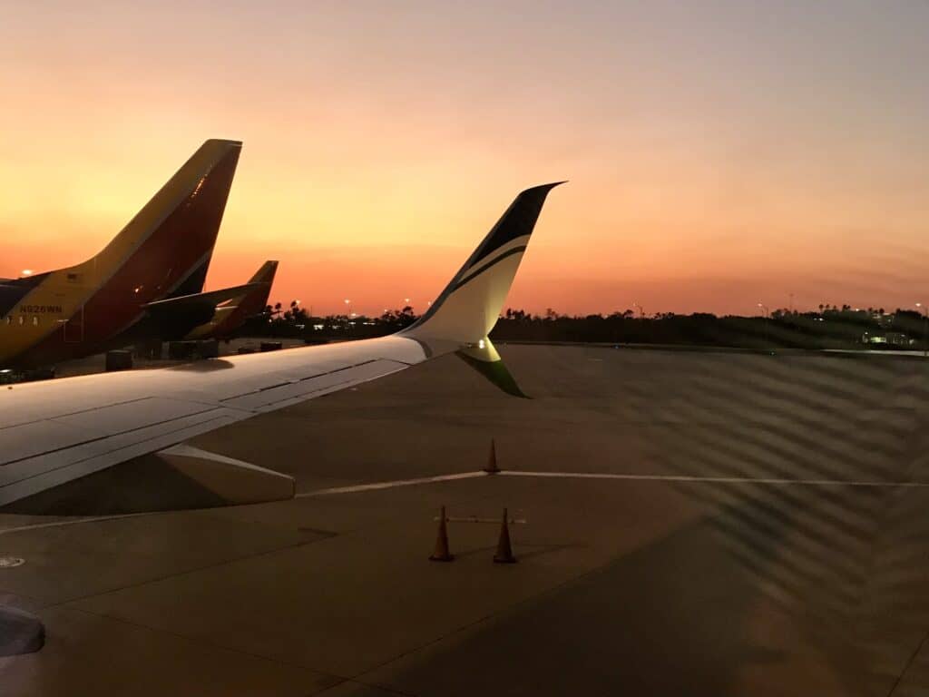 Airplanes on the tarmac at sunset