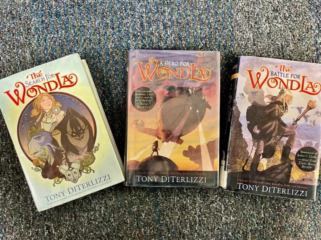 WondLa trilogy books laid on carpet.