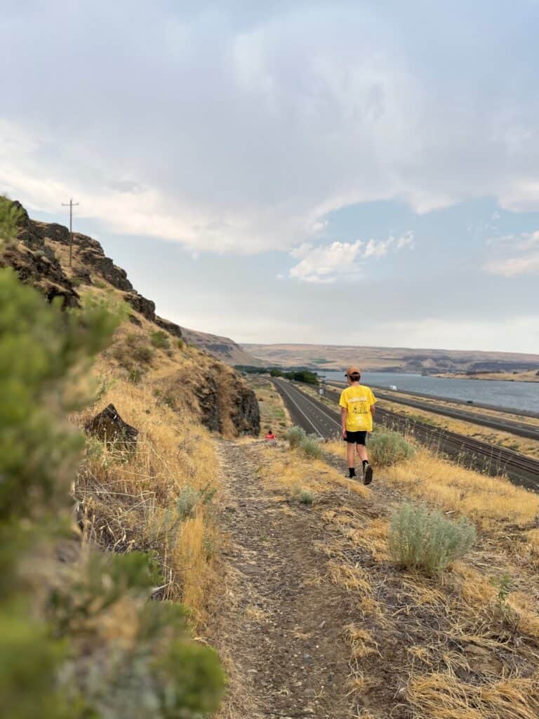 Our son walks in Oregon Trail ruts above the Columbia River.