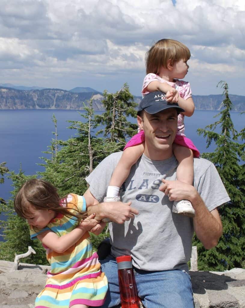 My daughters look everywhere except the camera at a picture at Crater Lake NP.