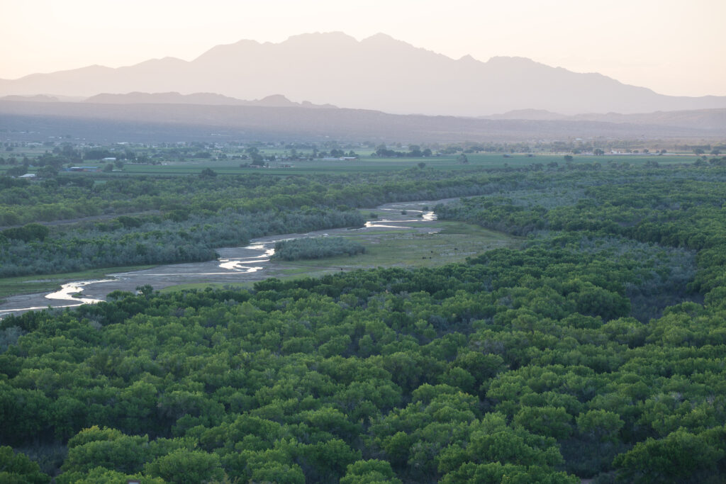 Mist hovers over a verdant valley along El Camino Real del Tierra Adentro NHT.