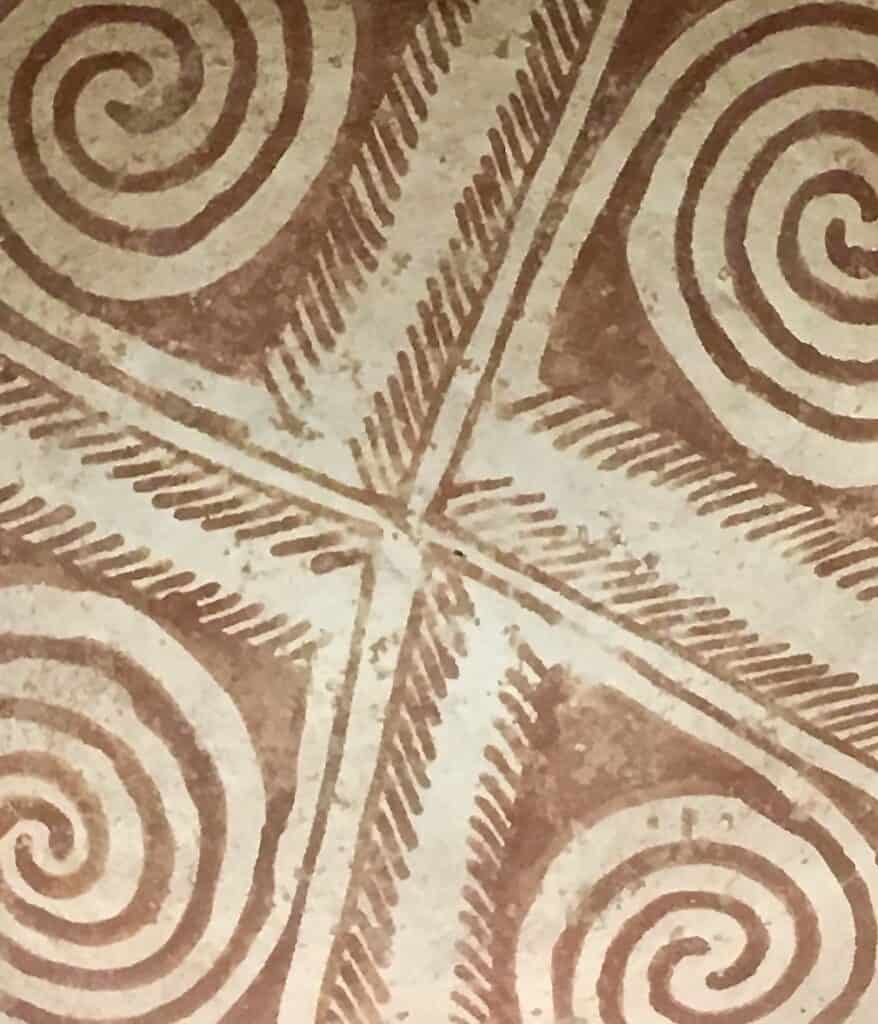 Stylized patterns cover the bottom of a Hohokam bowl.