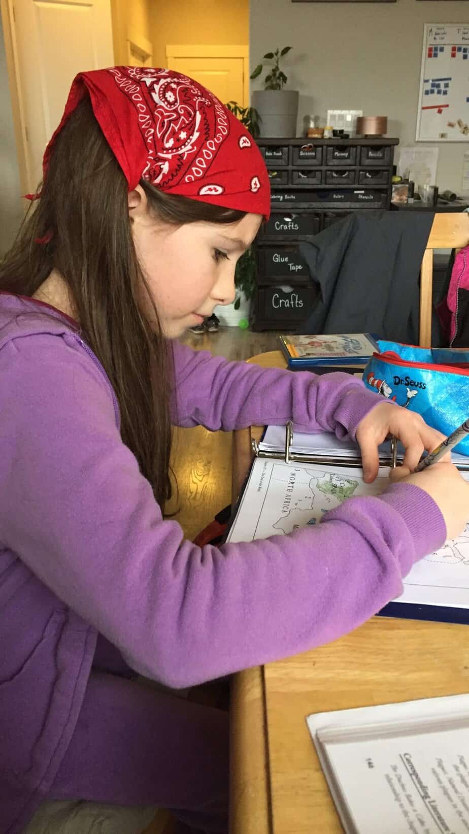 Our daughter works on a history map