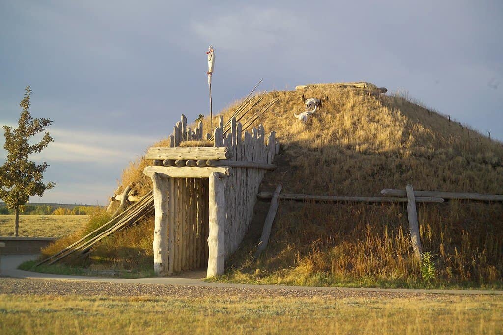 Late afternoon sun gilds an indigenous shelter at Knife River National Historic Site.