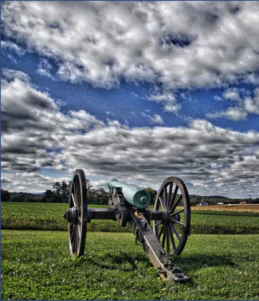 A canon looks over farmland at Monocacy National Battlefield.