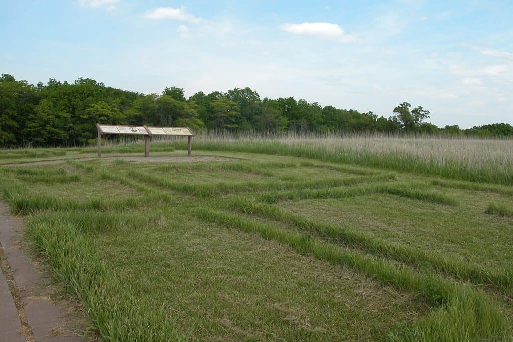 An interpretive plaque stands beside the ruins of a Mormon waypoint on Mormon Pioneer National Historic Trail.