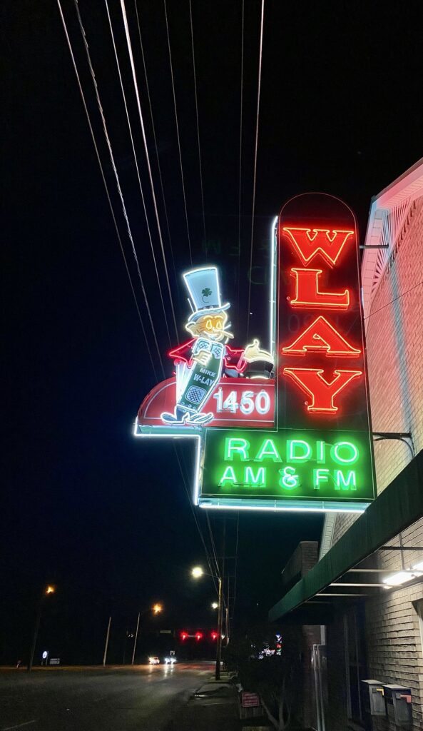 A historic radio channel sign lights up the night at Muscle Shoals National Heritage Area.