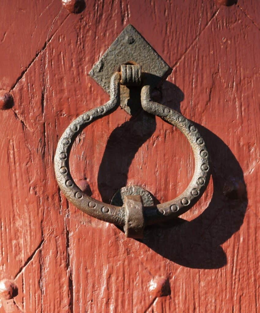 A historic knocker rests on a door at Saugus Iron Works National Historic Site.
