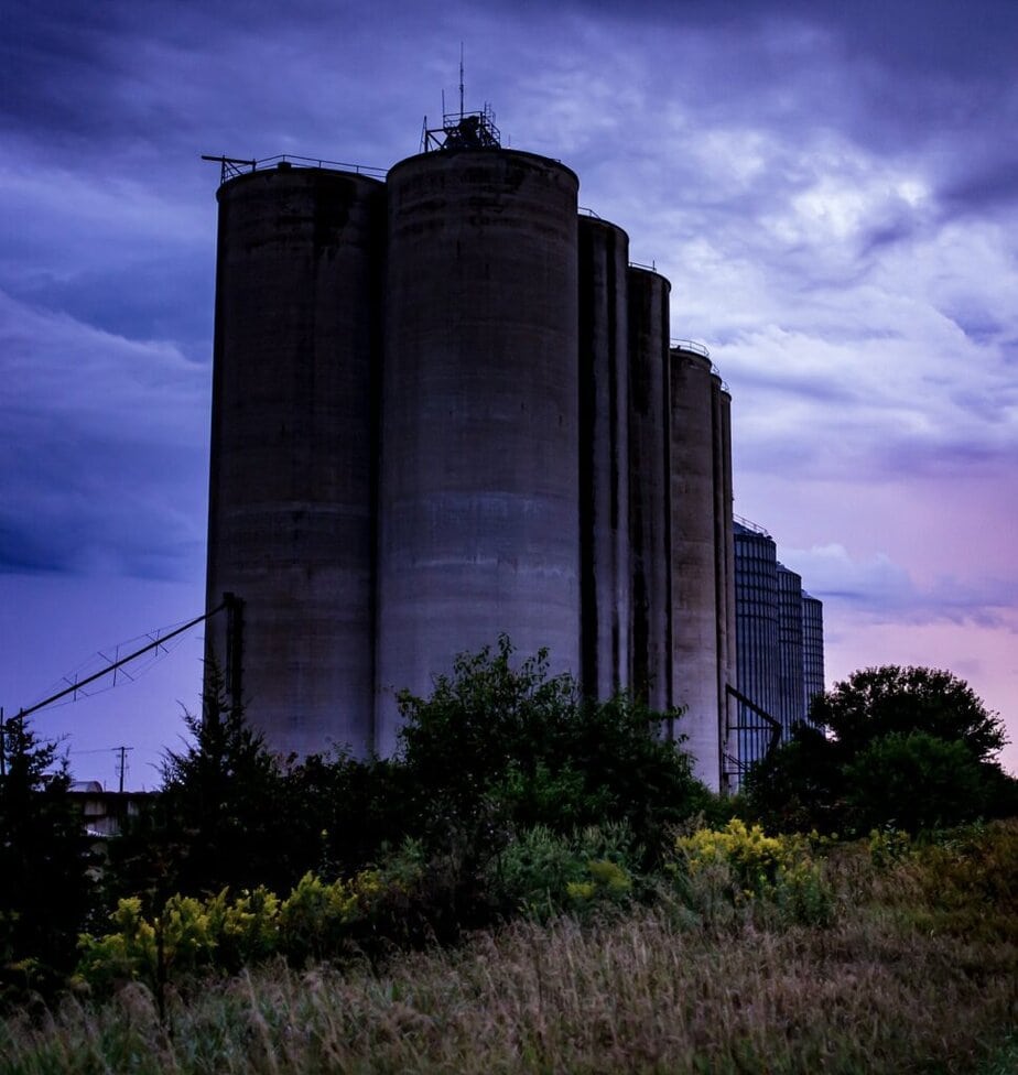 Silos stand in the evening light at Silos and Smokestacks National Heritage Area.