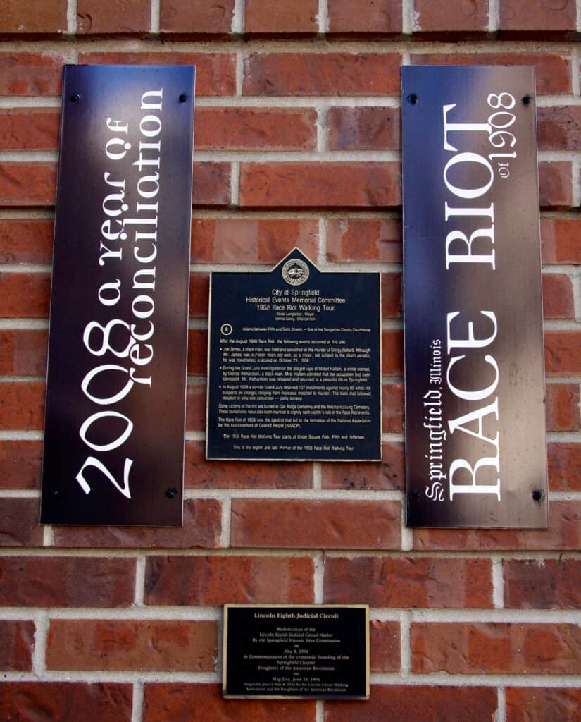 A memorial plaque tells the story of the 1908 Springfield Race Riot at Springfield 1908 Race Riot National Monument.