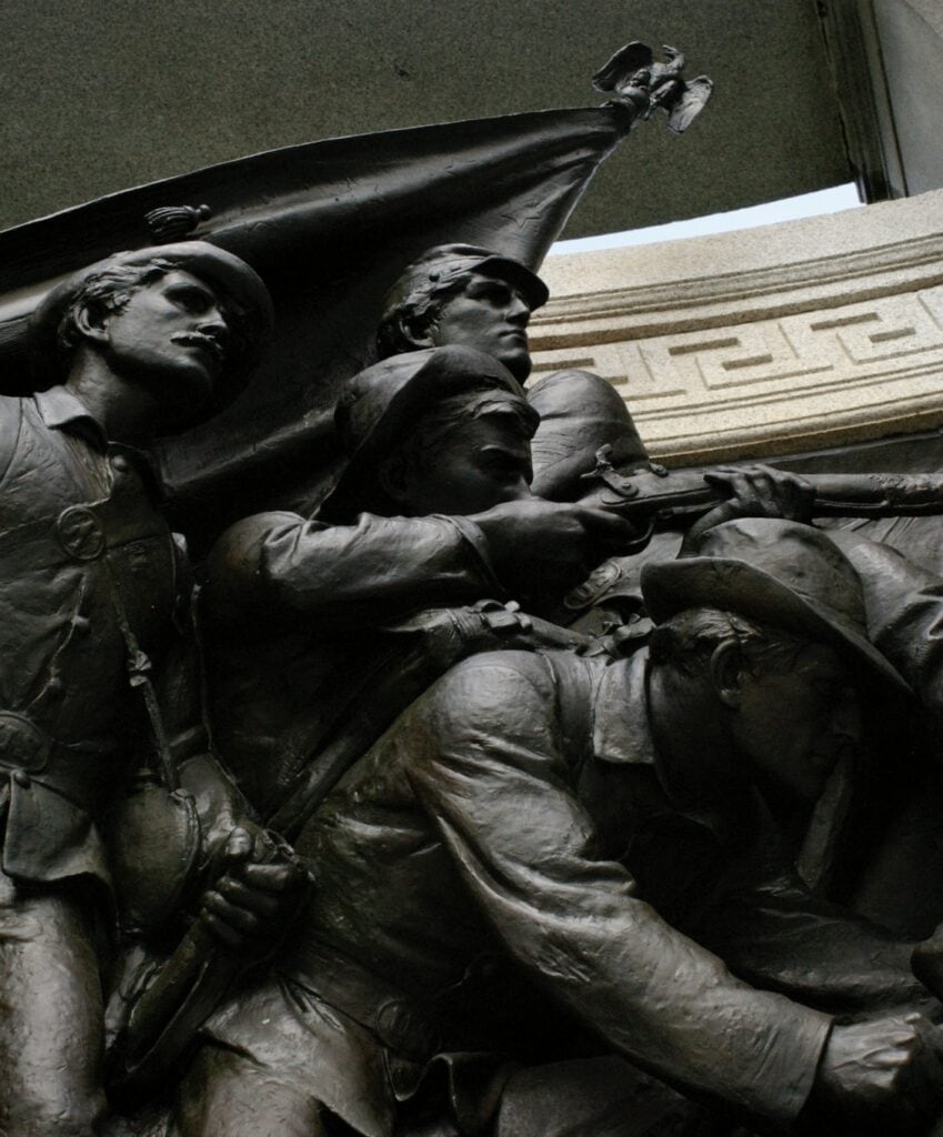 Soldiers press forward in a bronze monument at Vickburg National Military Park.