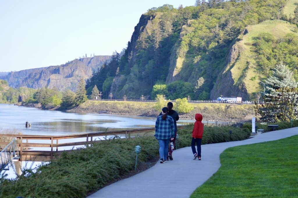 Jenn and two children walking along the Waterfront Trail near the Riverside Restaurant in Hood River