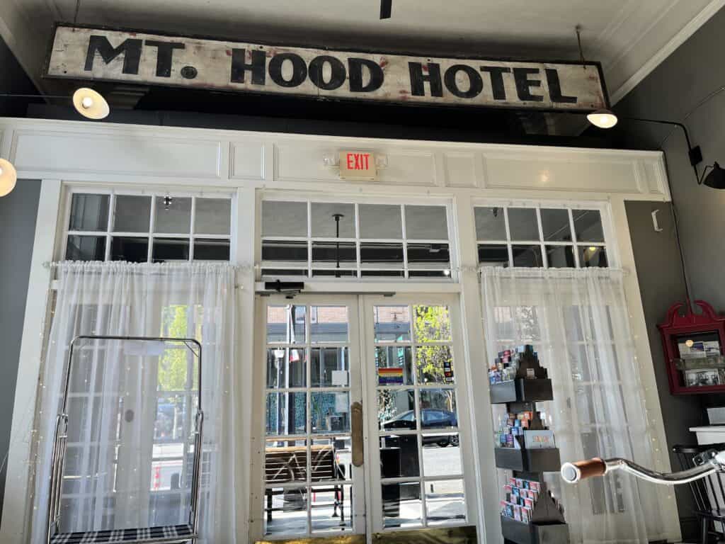 Inside front entrance of the Hood River hotel with historic sign that says Mt. Hood Hotel