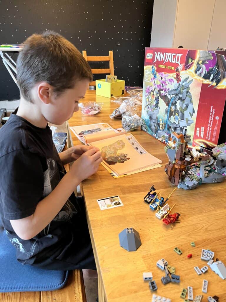 Our son working on the Lego Ninjago Dragon Shrine
