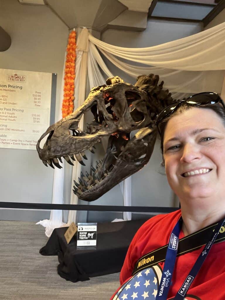 Jenn in front of T. rex model head photo op