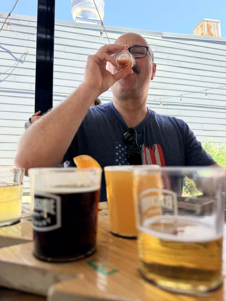 Brian tries one of the beers at Backside Brewing Co.