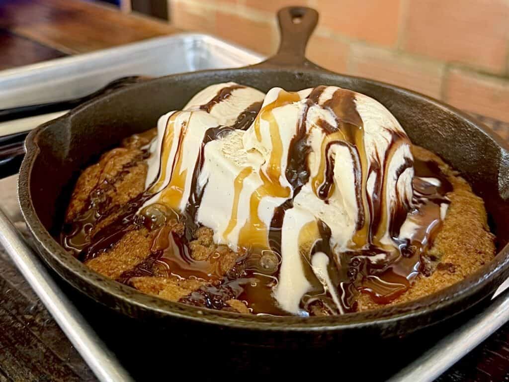 Melting ice cream on a hot baked skillet cookie.