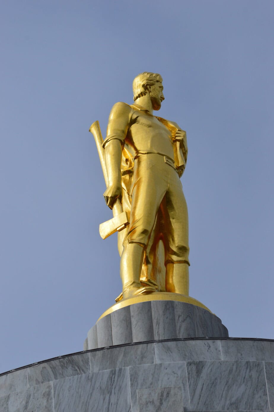 Golden pioneer statue atop the Oregon State Capitol building in Salem.