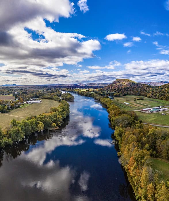 A river reflects the clouds along the New England Scenic Trail, Massachusetts.