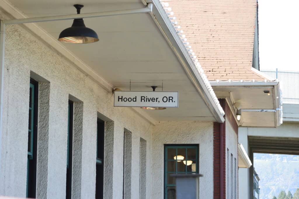 Train depot sign says "Hood River, OR."