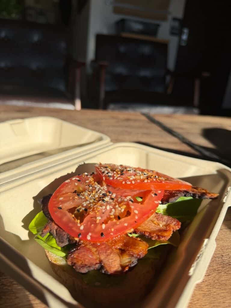 Avocado toast topped with bacon, tomato and everything seasoning at Solvivo Coffee Roasters in Silverton. 