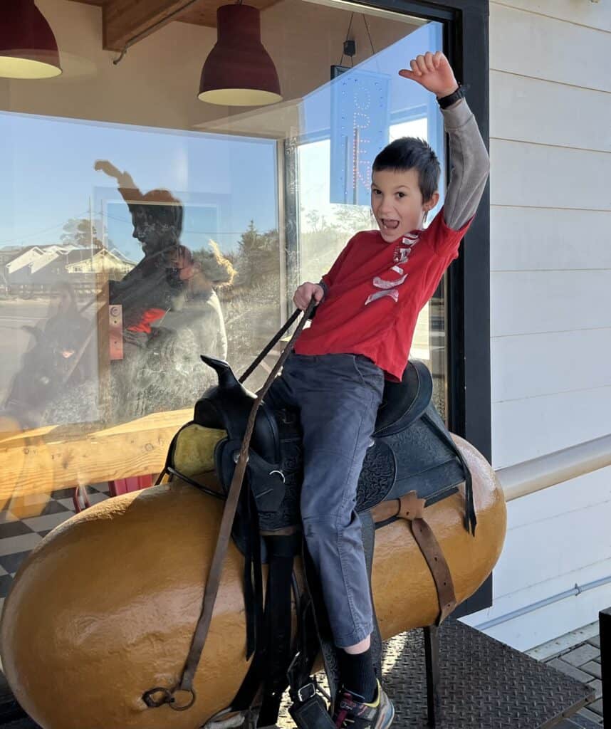 My son rides an enormous corn dog at Pronto Pup in Rockaway Beach. Rockaway Beach is one of the 15 hidden gems of Oregon.