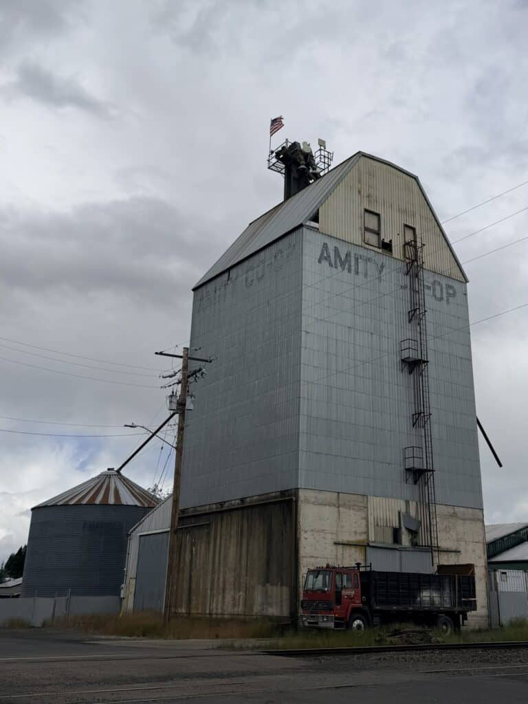 Amity silo next to train tracks.
