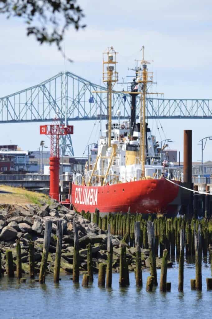 The lightship Columbia sits at a dock at Astoria, Oregon. Astoria is one of 7 unique Old Oregon historic sites in Oregon.