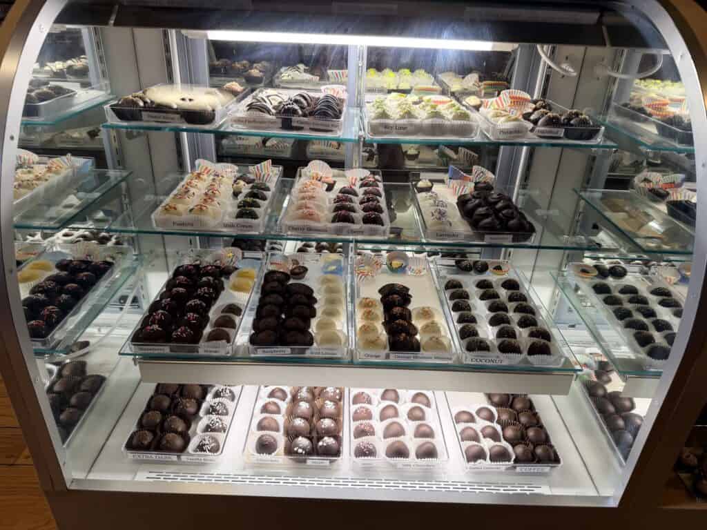 Chocolate truffles in a glass case at the Monastery chocolate shop.