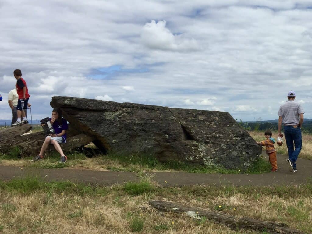 Our kids and Brian exploring Erratic Rock State Natural Site.